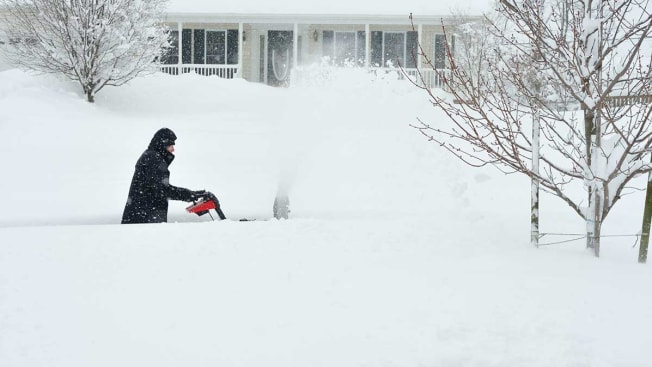 snow blower blowing snow